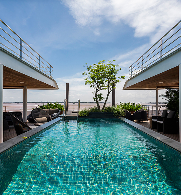 Outdoor pool on the Scenic Spirit ship, offering views of the river.